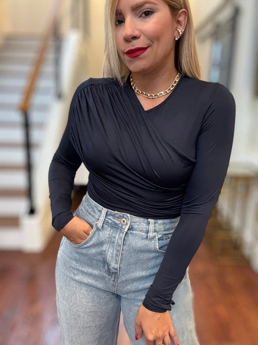 Dark blue long-sleeve bodysuit with V-neck wrap fit and ruched front