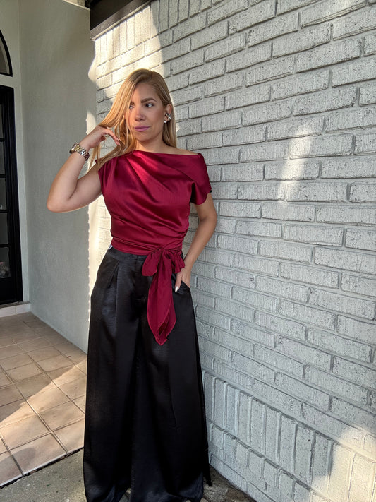 Teresa top in burgundy satin with boat neck, puff sleeves, and waist tie detail