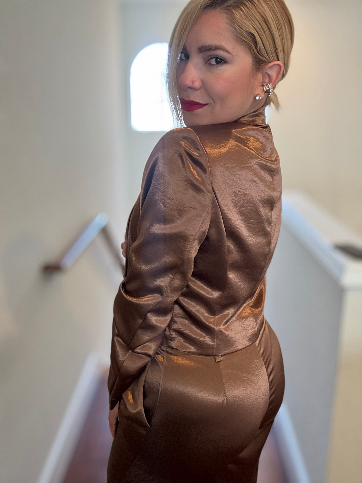 Bronze satin jumpsuit back view with long sleeves and waist drawstring