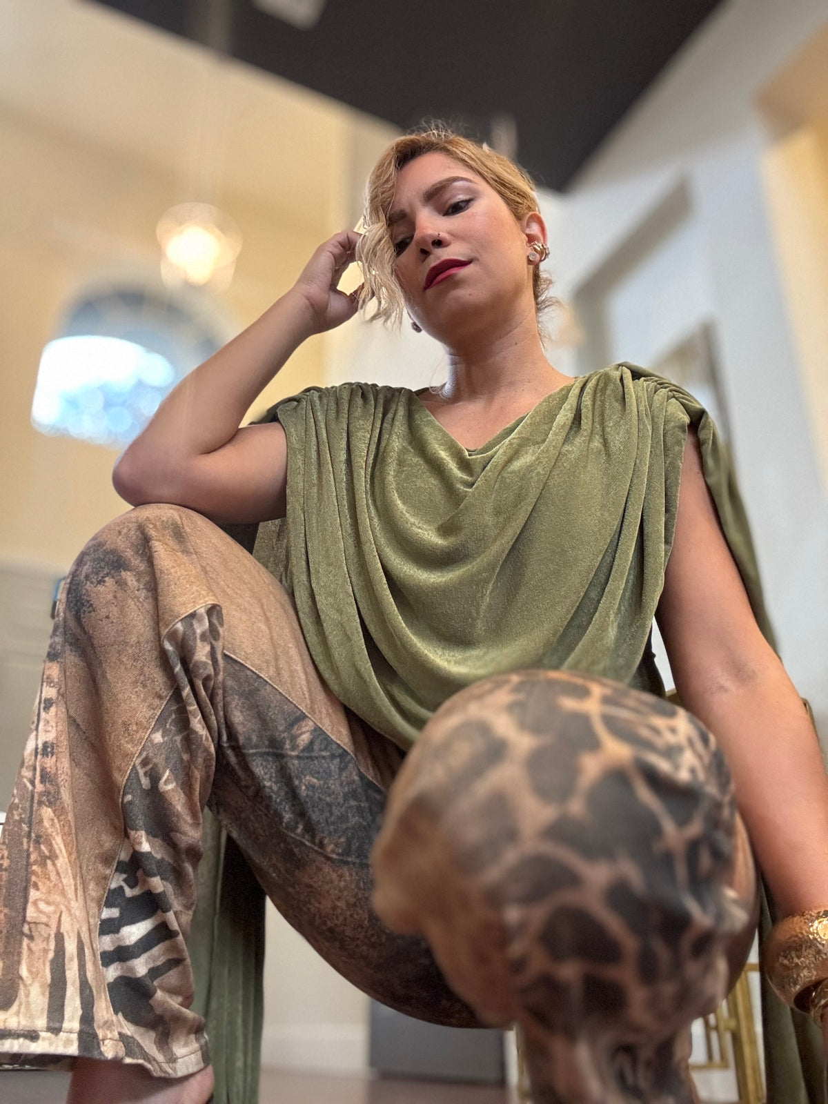 Wide-leg jeans with leopard-print and zebra-like accents in tan and dark brown