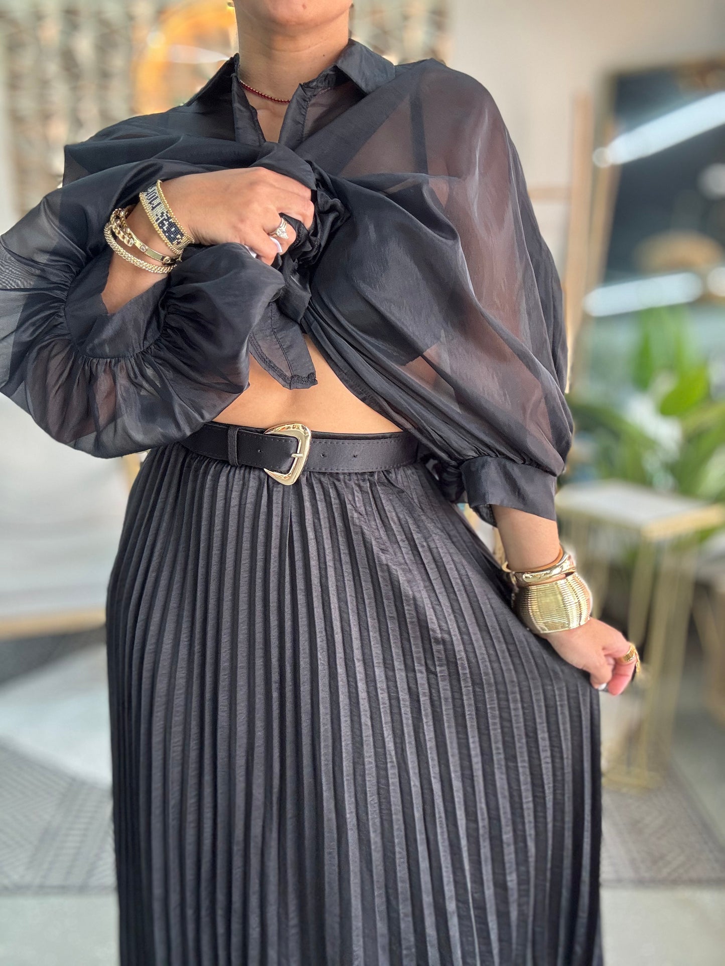 Black pleated midi skirt with vertical rib texture and elastic gathered waist