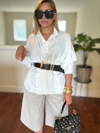 White button-up peplum top with short sleeves and pleated front detail
