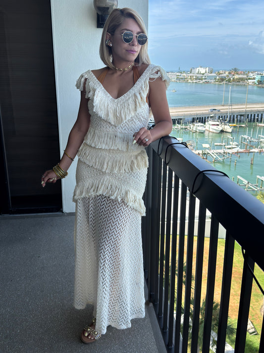 Off-white ruffled sleeveless top with tiered fringe and long zigzag maxi skirt