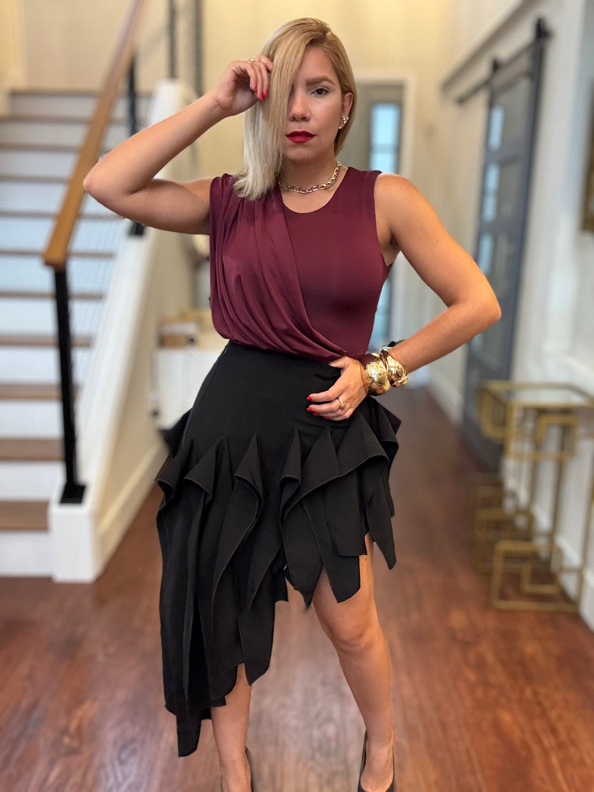 Black ruffle tier mini skirt with layered, scalloped hem