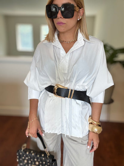 White button-up peplum top with ruffled front panel and short sleeves
