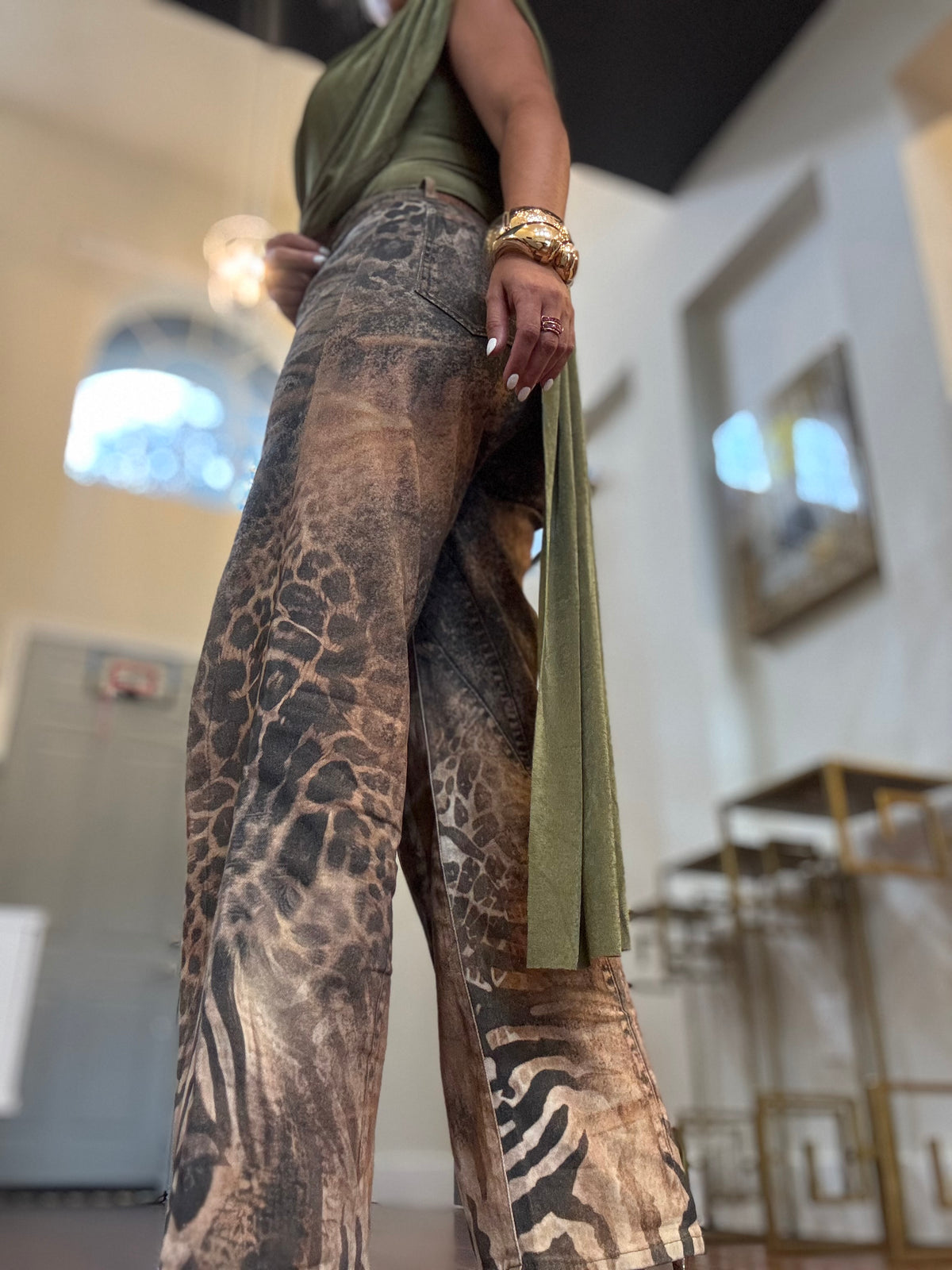 Wide-leg jeans side view with leopard pattern and distressed wash in tan and brown