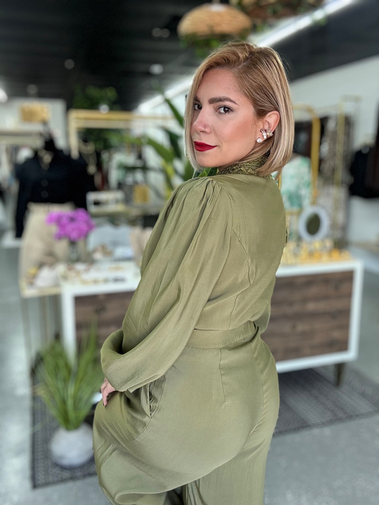 Olive green blouse and wide-leg pants set, side view with puff sleeves
