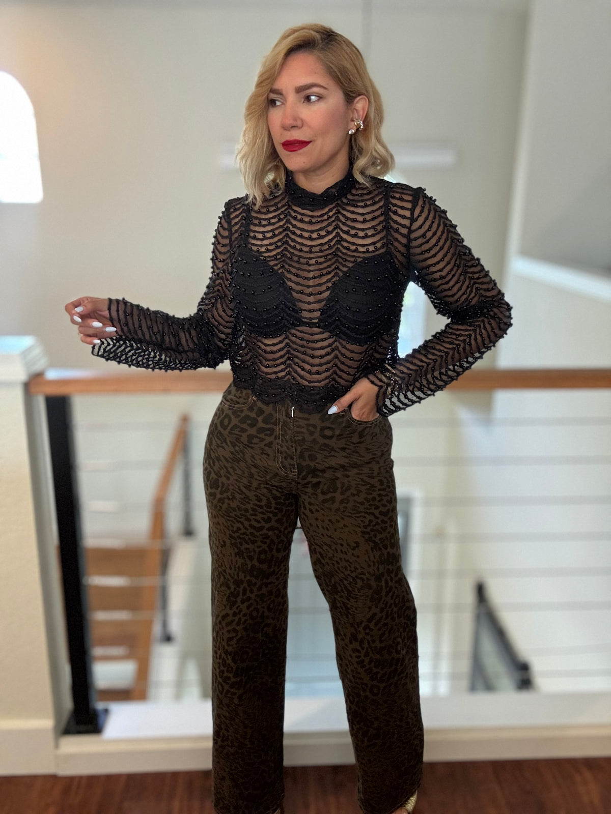 Leopard-print jeans in dark brown with black animal pattern, relaxed straight-leg fit