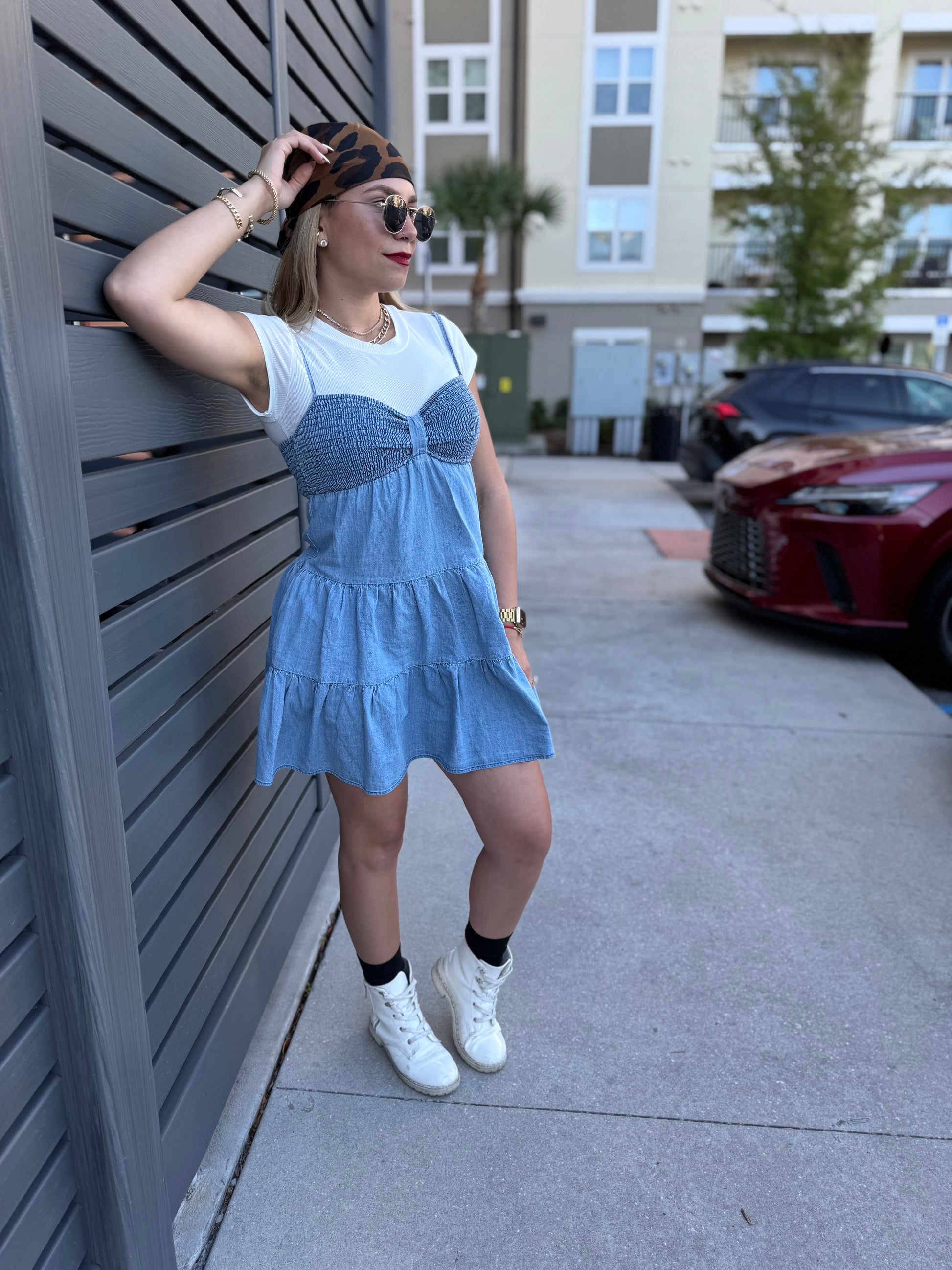 Two-tone light blue dress with white cap sleeves and tiered ruffle skirt, side view