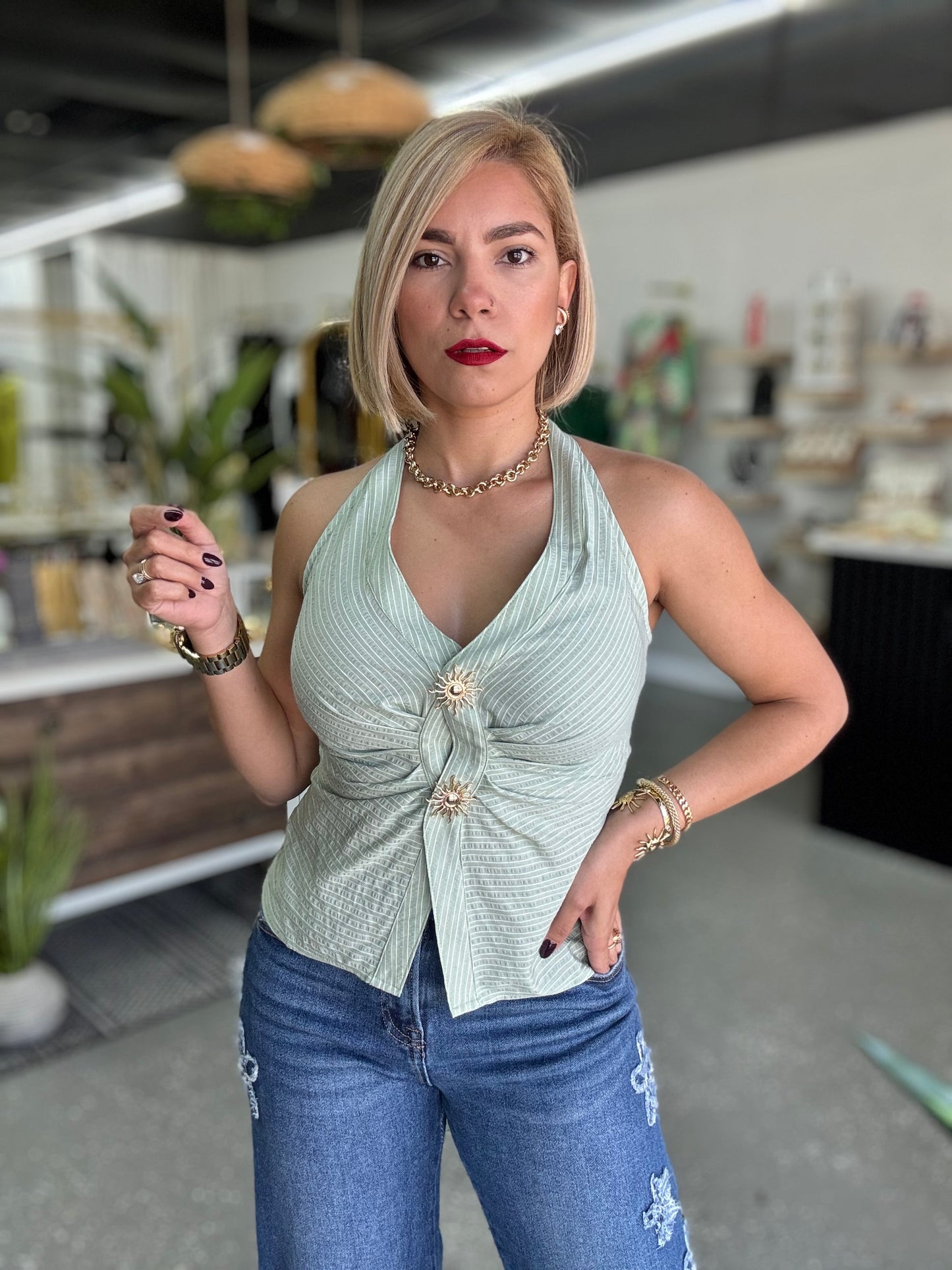 Light green halter top with deep V front, gathered seam and gold button detail