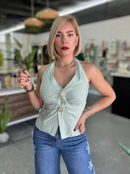 Light green halter top with deep V front, gathered seam and gold button detail