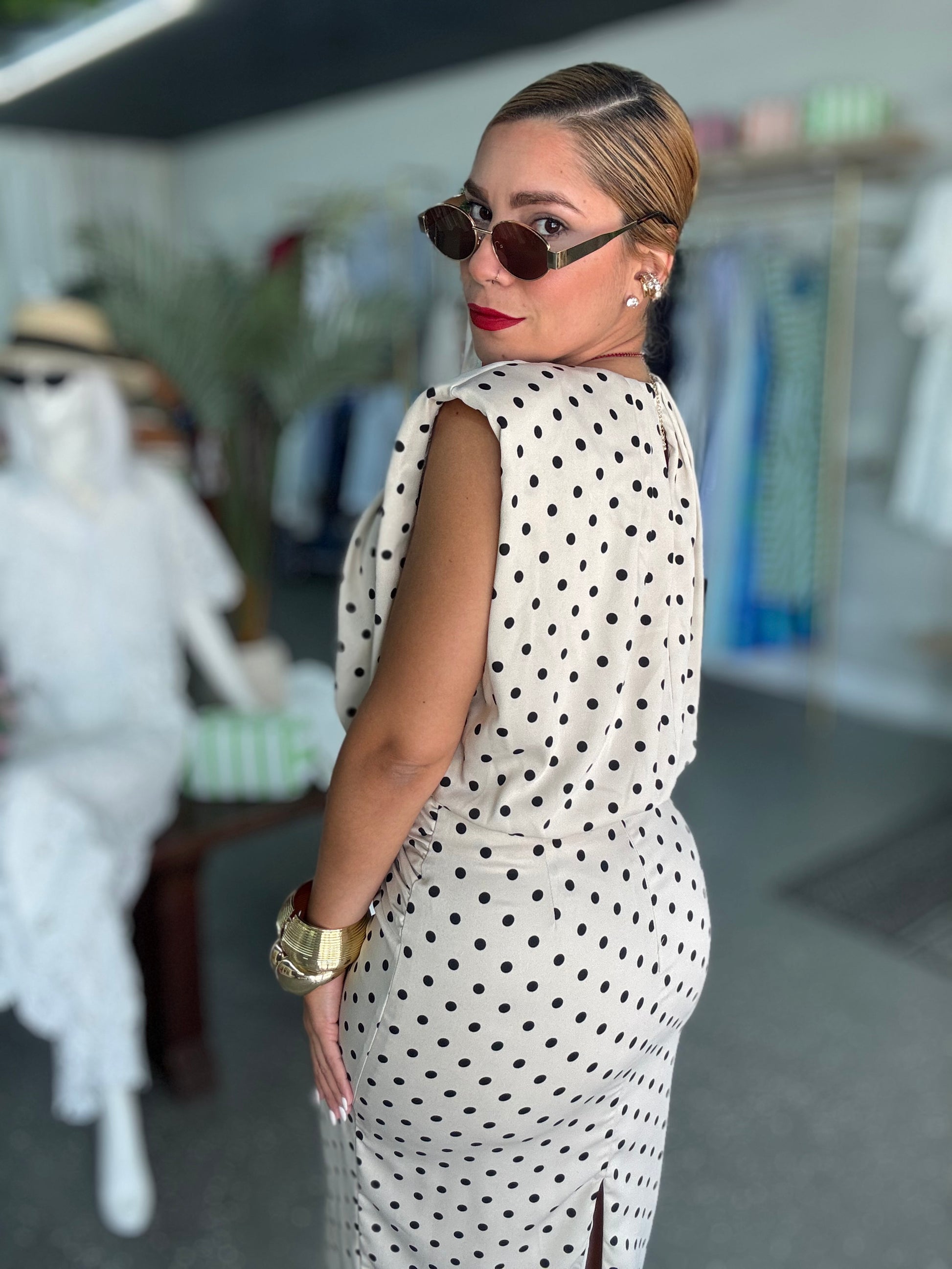 Executive set dress, sleeveless polka-dot midi from side view with tie waist