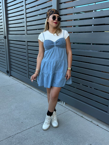 Two-tone light blue dress with white cap sleeves and tiered skirt, full-body front view