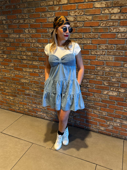 Two-tone light blue dress with white cap sleeves and fluttery tiered skirt, front angle