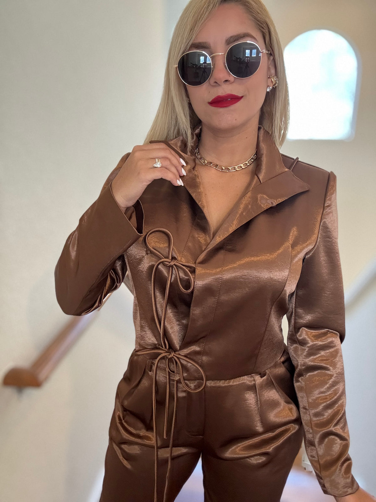 Bronze satin jumpsuit with tie-front details and fitted waist drawstring