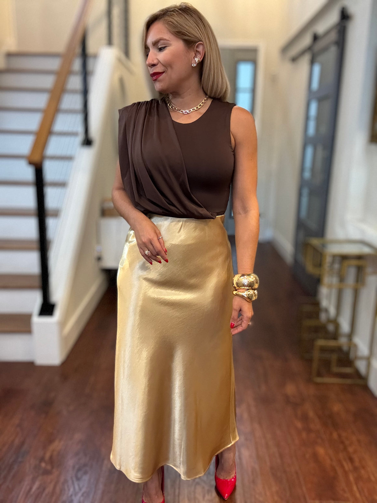 Gold satin midi skirt with smooth sheen and mid-calf length