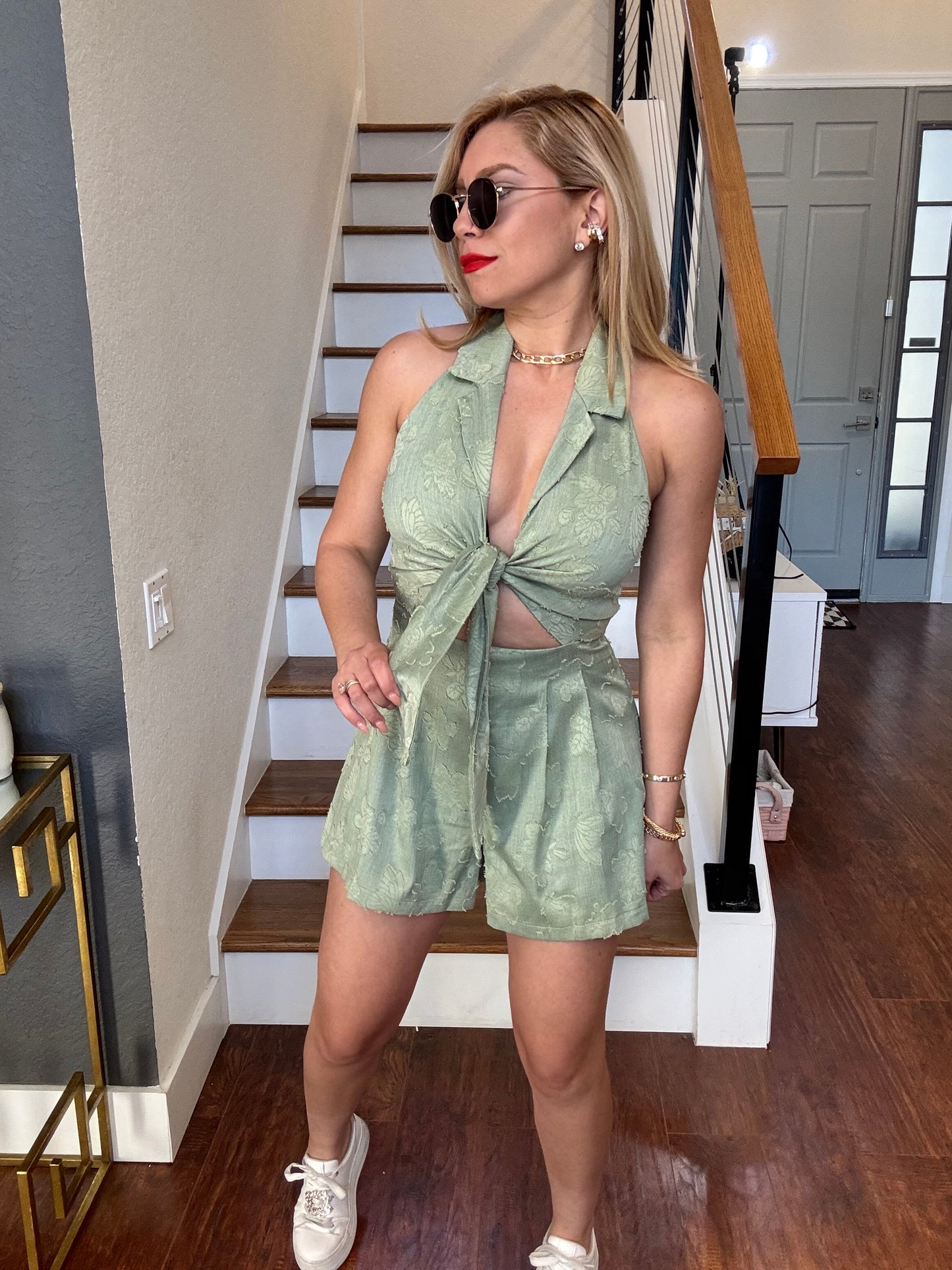 Light green halter romper with bow-tie front and deep V neckline