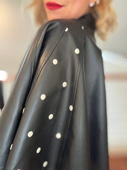 Black leather-style jacket shoulder with scattered stud embellishments