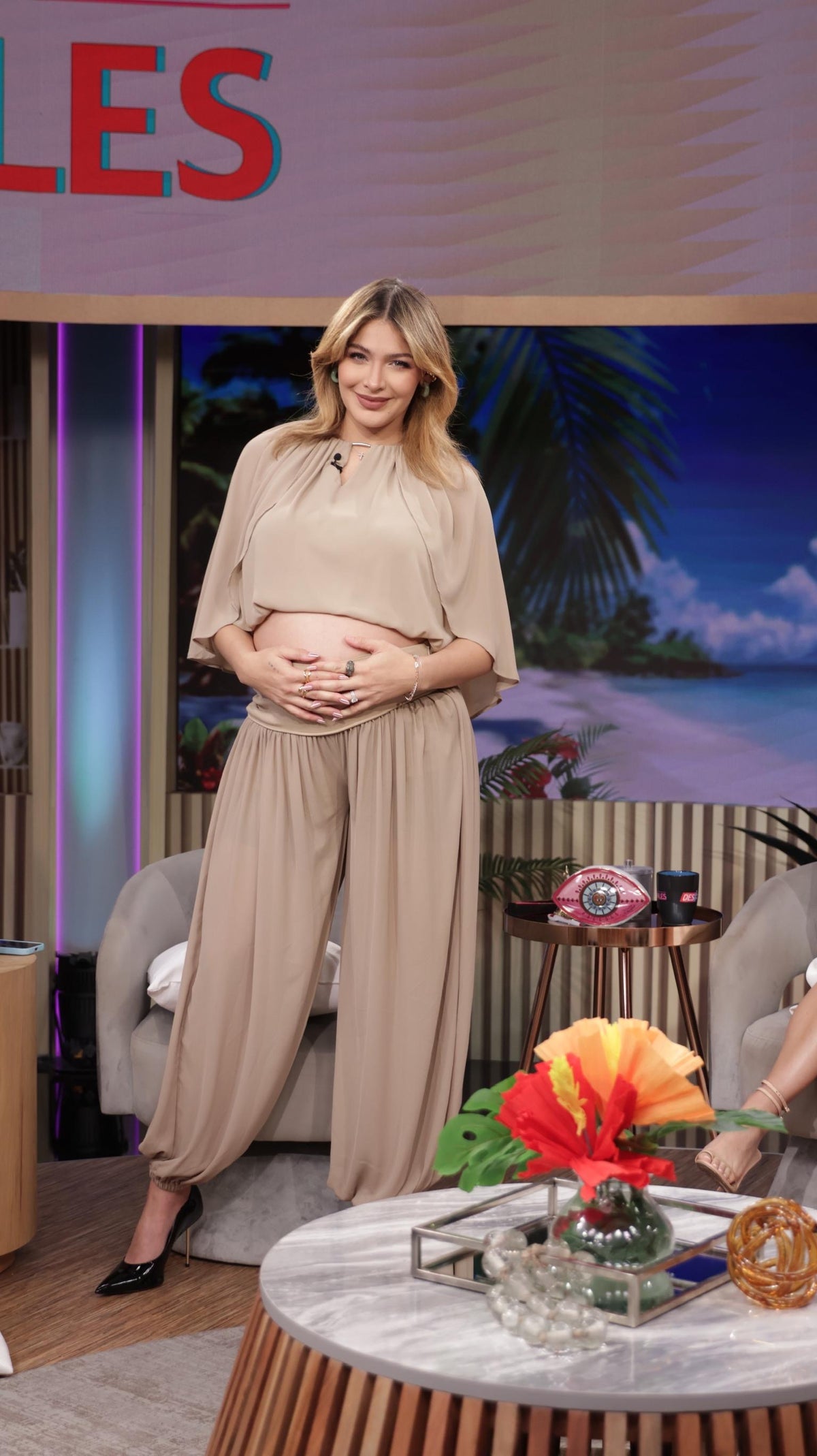 Beige blouse and wide-leg pants set with ankle-length flowy wide legs.