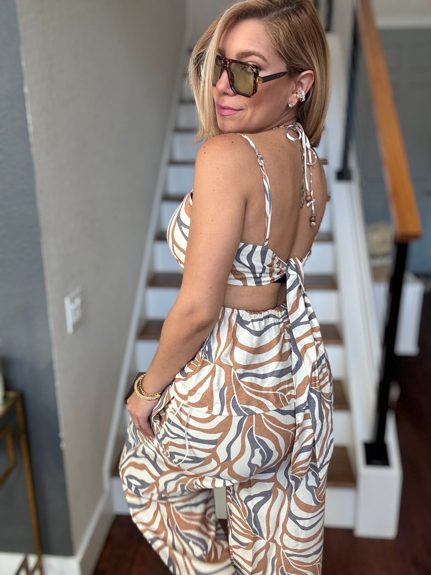 Alicia set sleeveless animal-print jumpsuit with open back and gathered waist