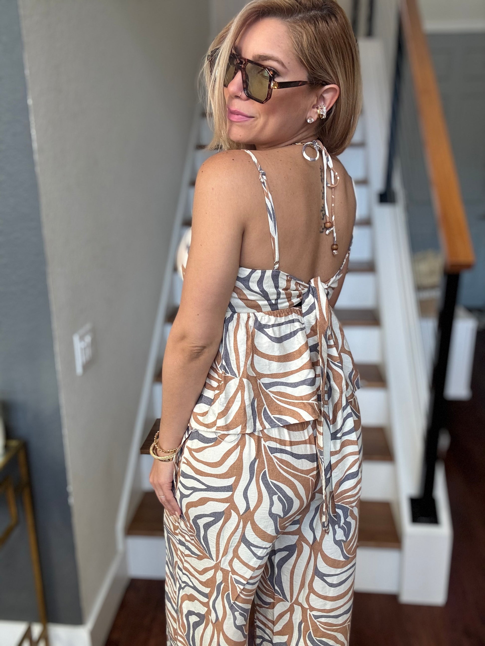 Alicia set sleeveless animal-print jumpsuit with open back and tie shoulder straps