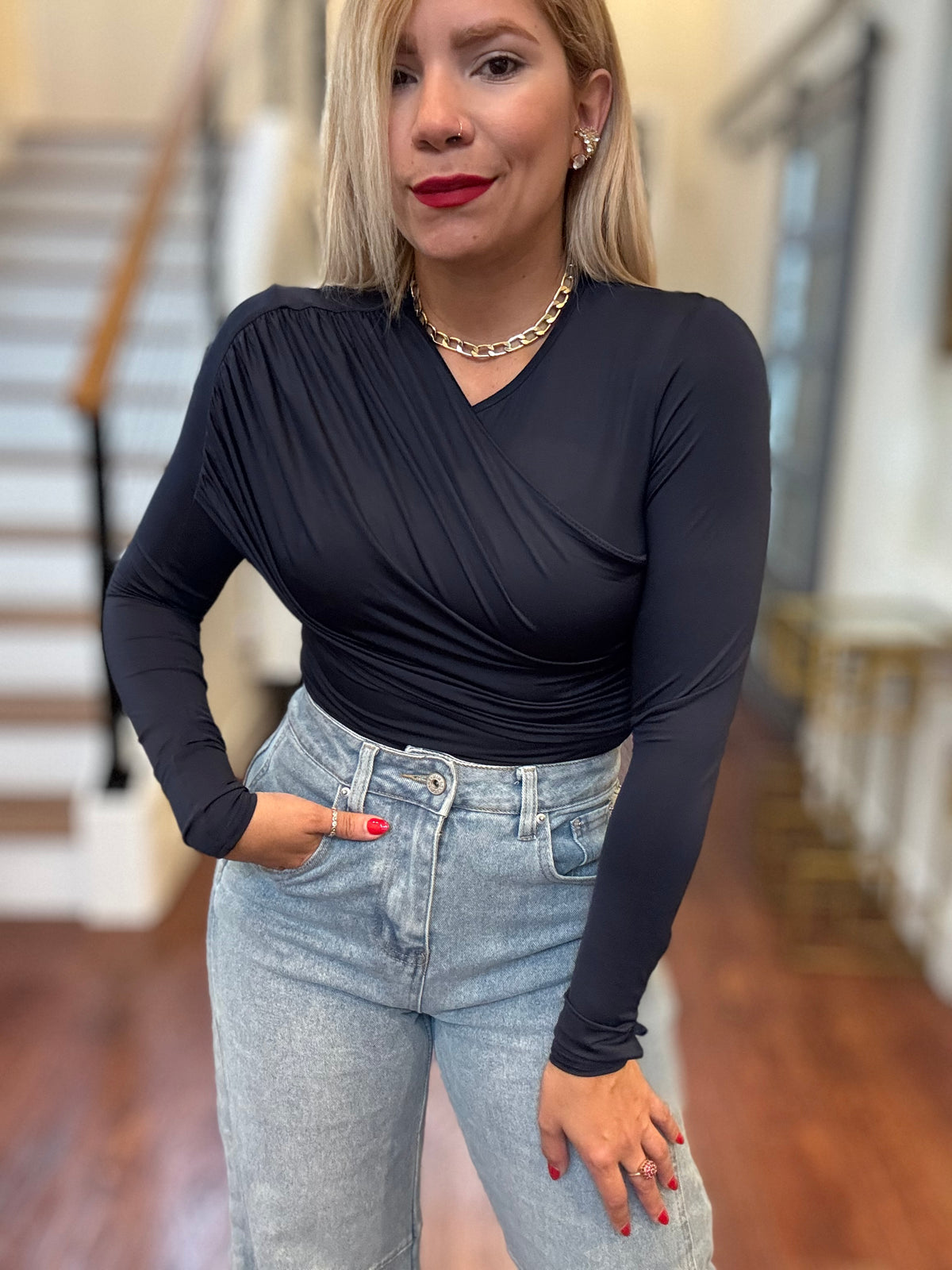 Dark blue long-sleeve bodysuit with ruched wrap V-neck and fitted sleeves