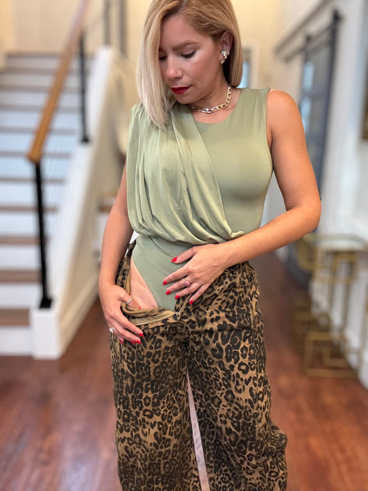 Light green sleeveless bodysuit with gathered front and scoop neckline
