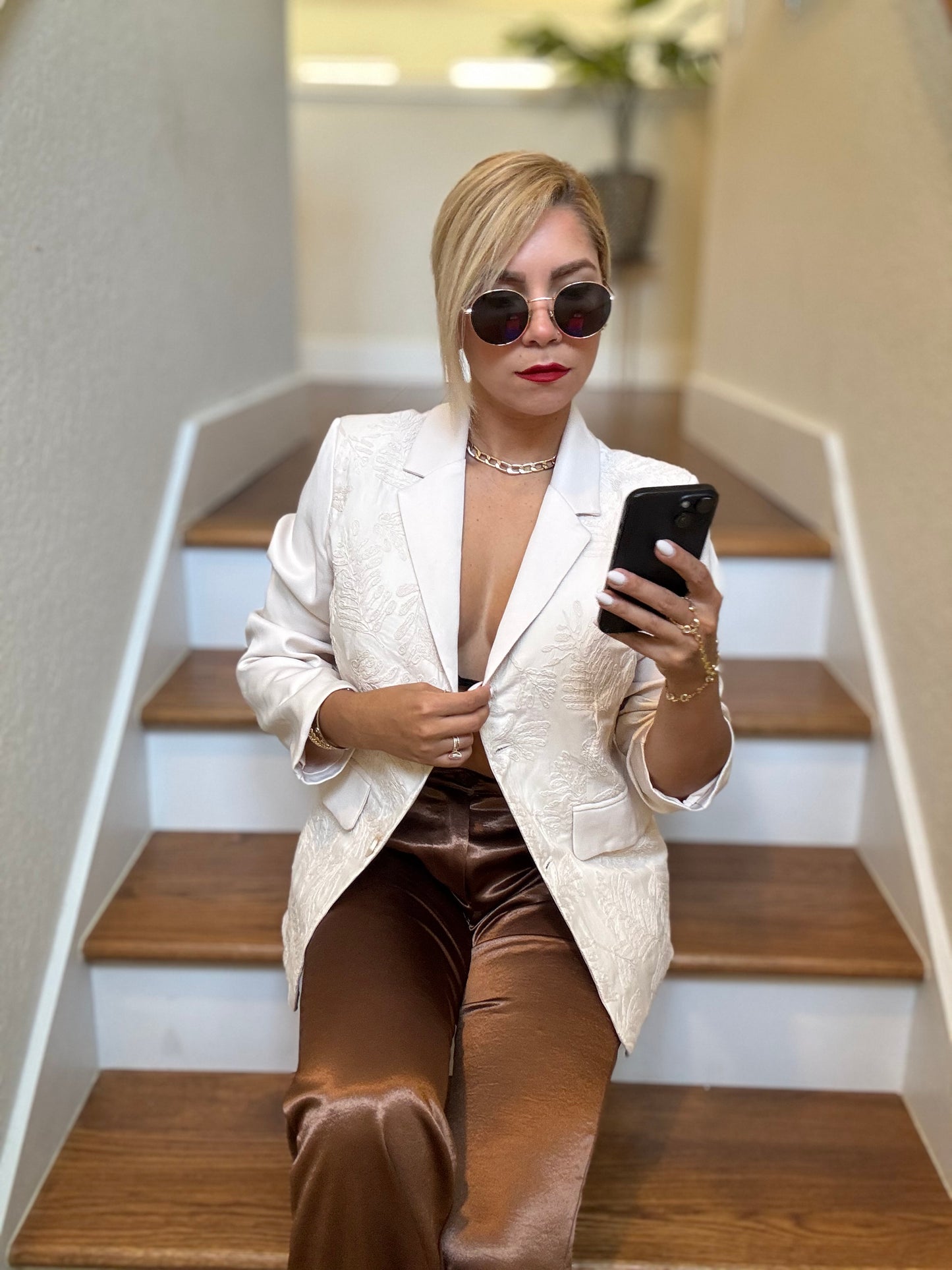 Ivory textured blazer with notch lapels and gold buttons, worn open