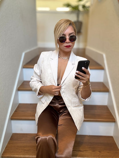 Ivory textured blazer with notch lapels and gold buttons, worn open