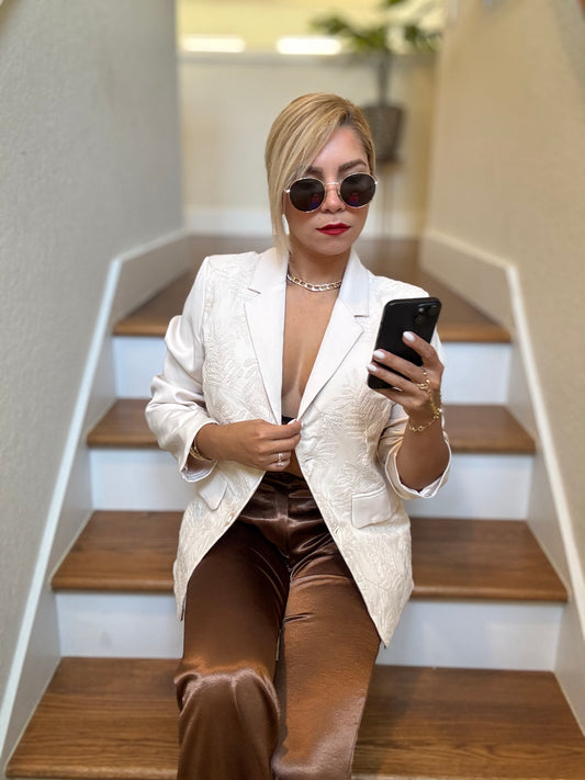 Ivory textured blazer with notch lapels and gold buttons, worn open