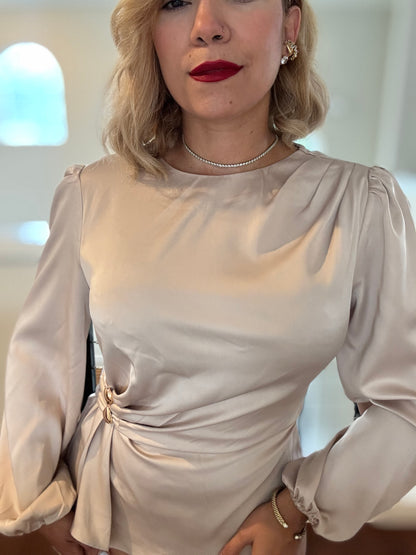 Beige satin top with puff sleeves, round neckline, and side waist knot