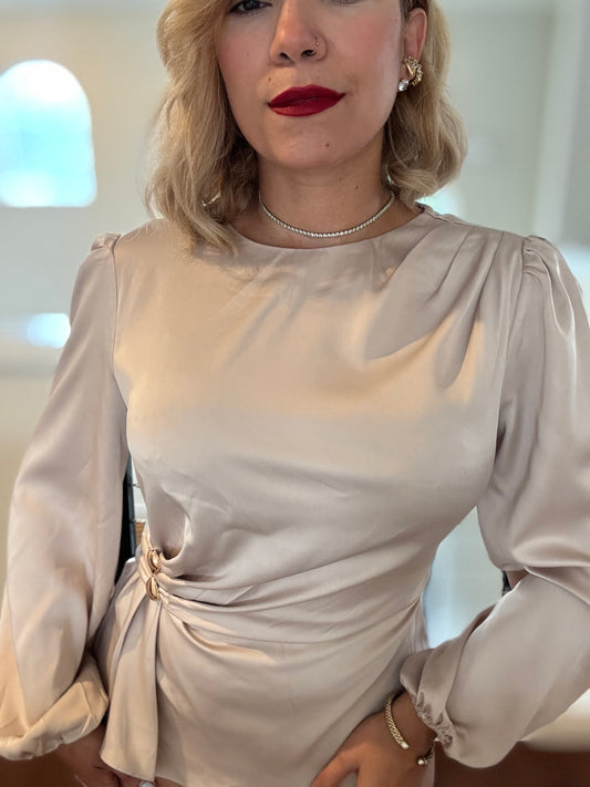 Beige satin top with puff sleeves, round neckline, and side waist knot