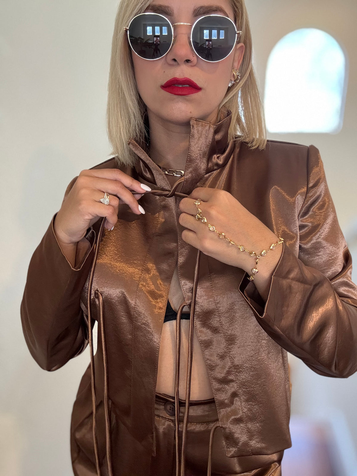 Bronze satin jumpsuit close-up with shawl collar and front tie drawstring