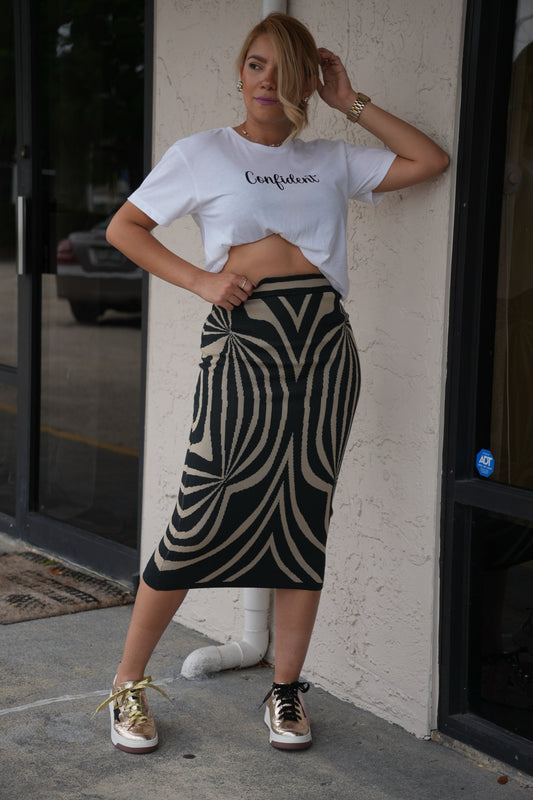 Dark midi pencil skirt with bold cream zebra-swipe pattern