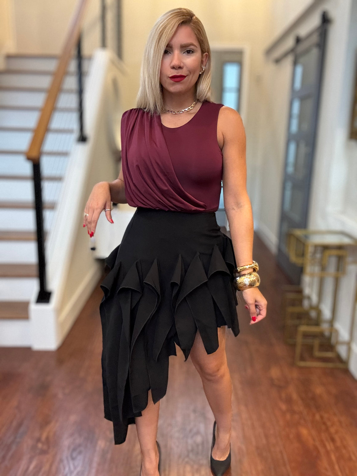 Black ruffle tier mini skirt with asymmetric layered pointed ruffles