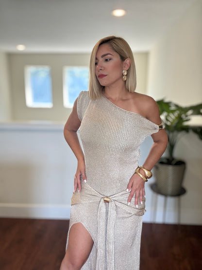 Estravaganza gold one-shoulder shimmer dress showing tie waist and thigh slit