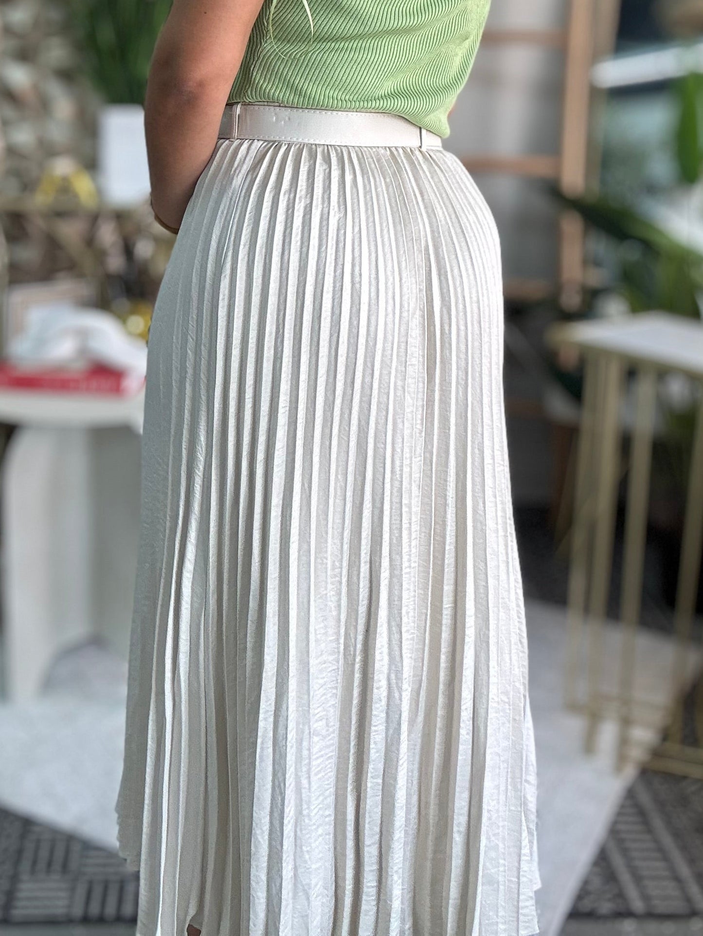 Ivory pleated midi skirt with vertical pinstripes and airy drape