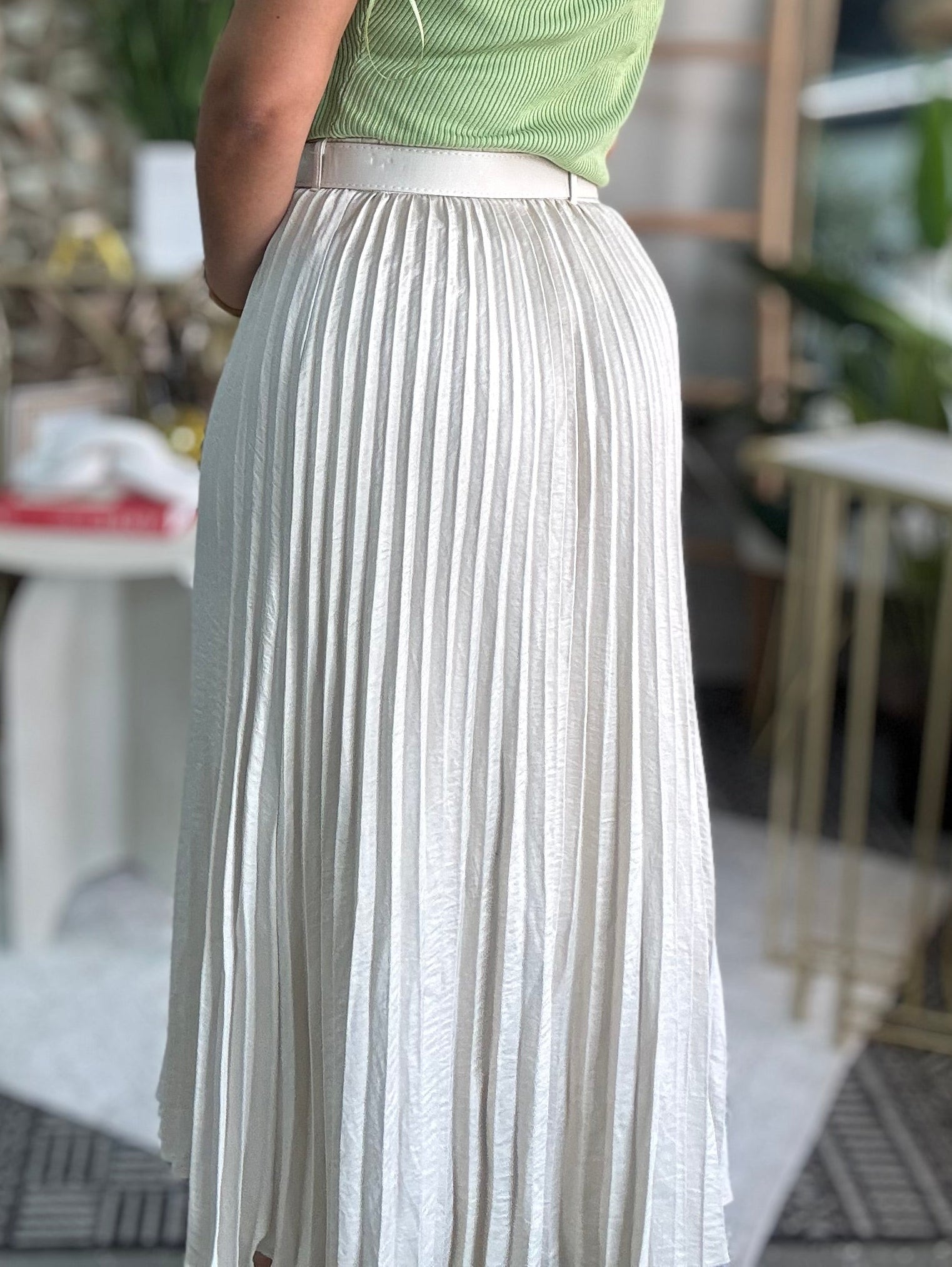 Ivory pleated midi skirt with vertical pinstripes and airy drape