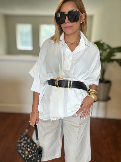White button-up peplum top with collar and layered ruffle hem