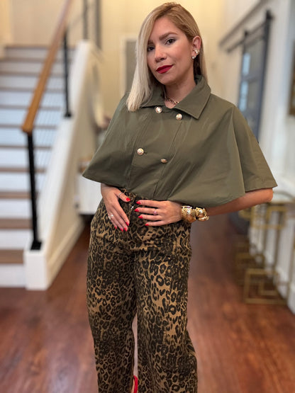 Olive green cape top with decorative gold coin buttons and pointed collar