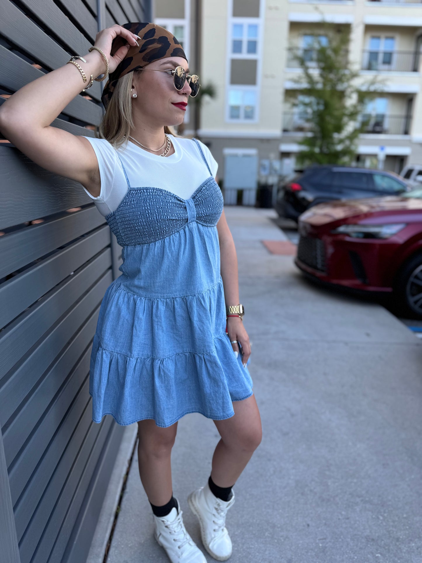 Light blue tiered mini dress with gathered waist and center bow detail