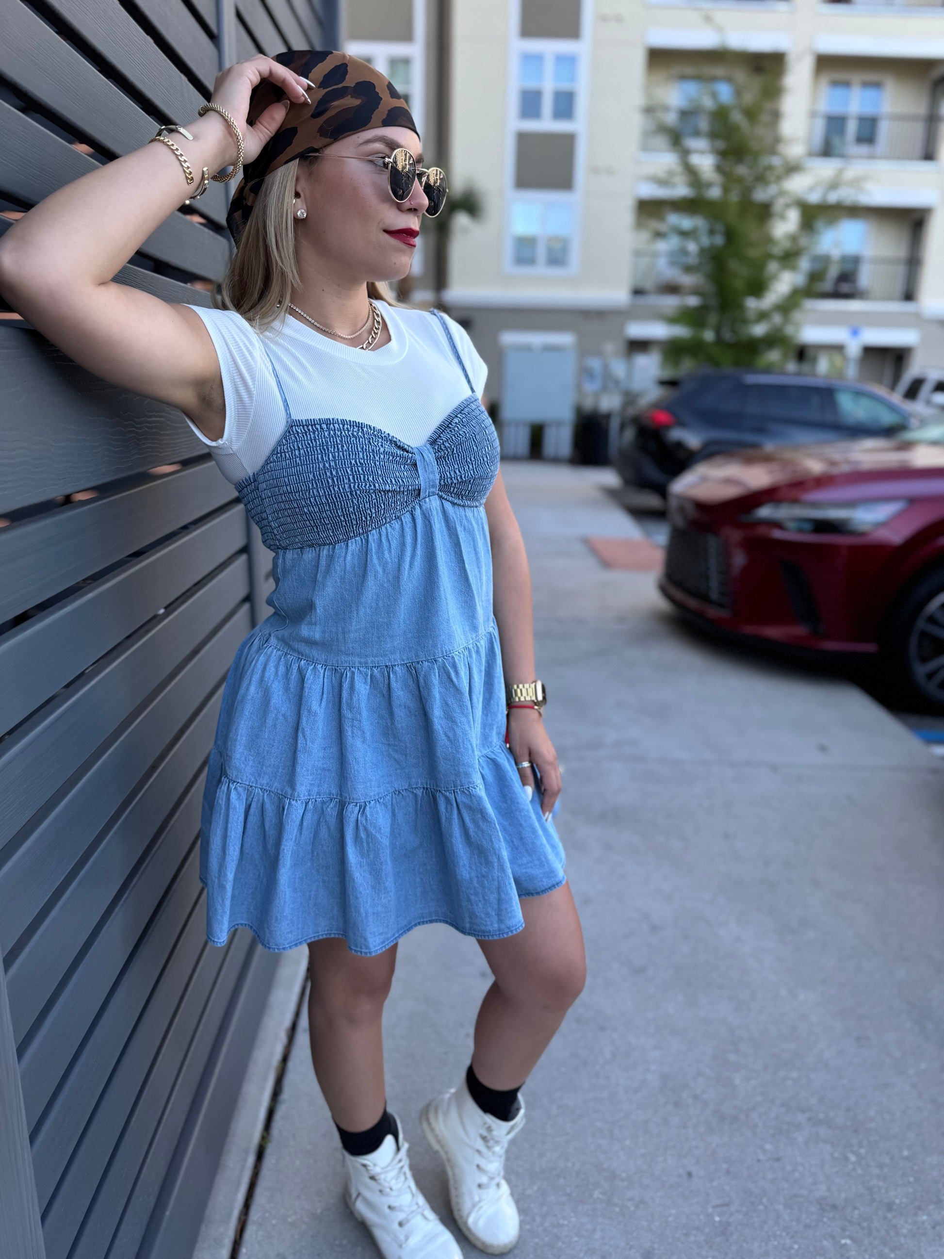 Light blue tiered mini dress with gathered waist and center bow detail