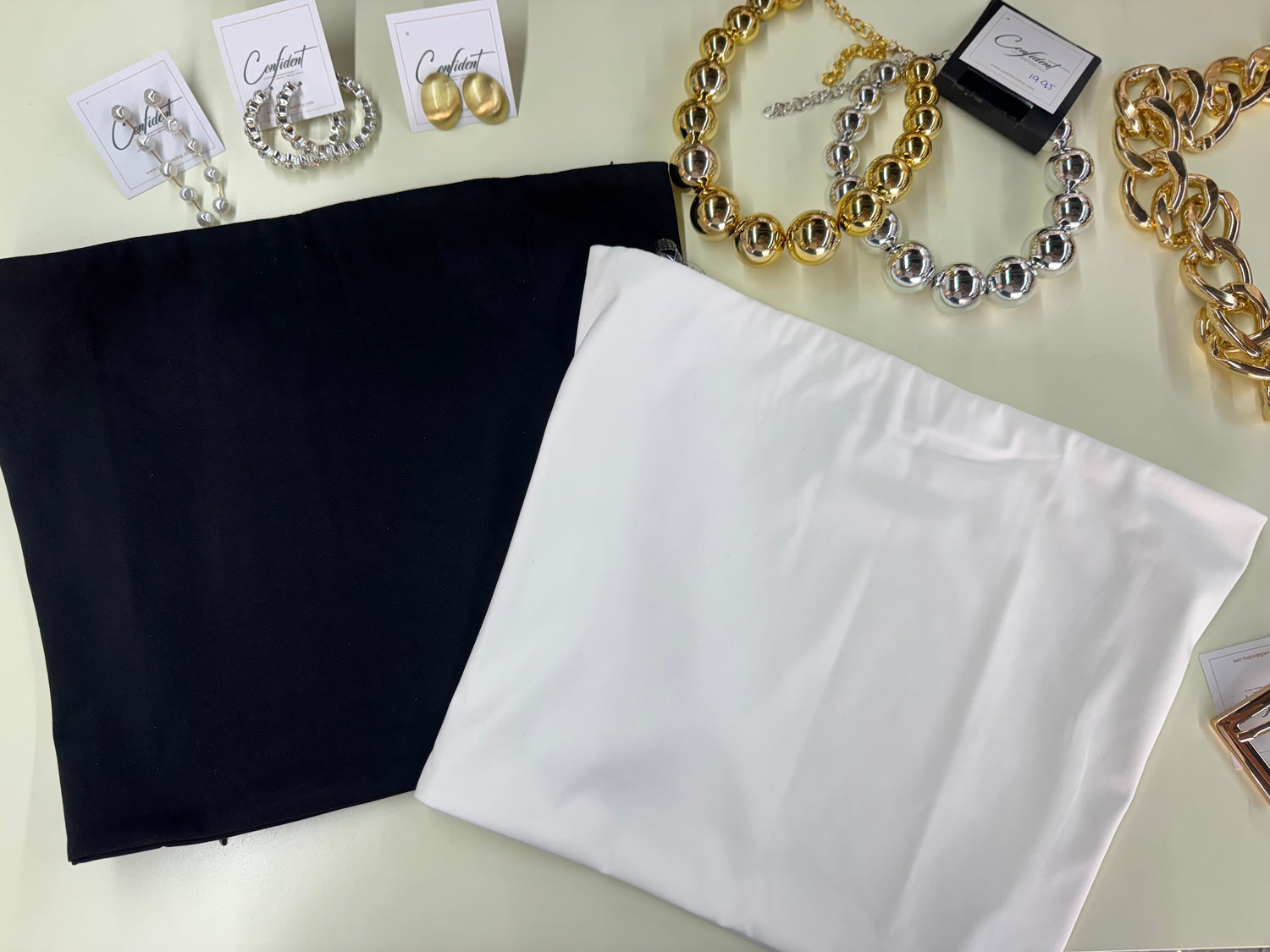 Black tube top and pants set, folded flat