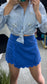 In blue skort