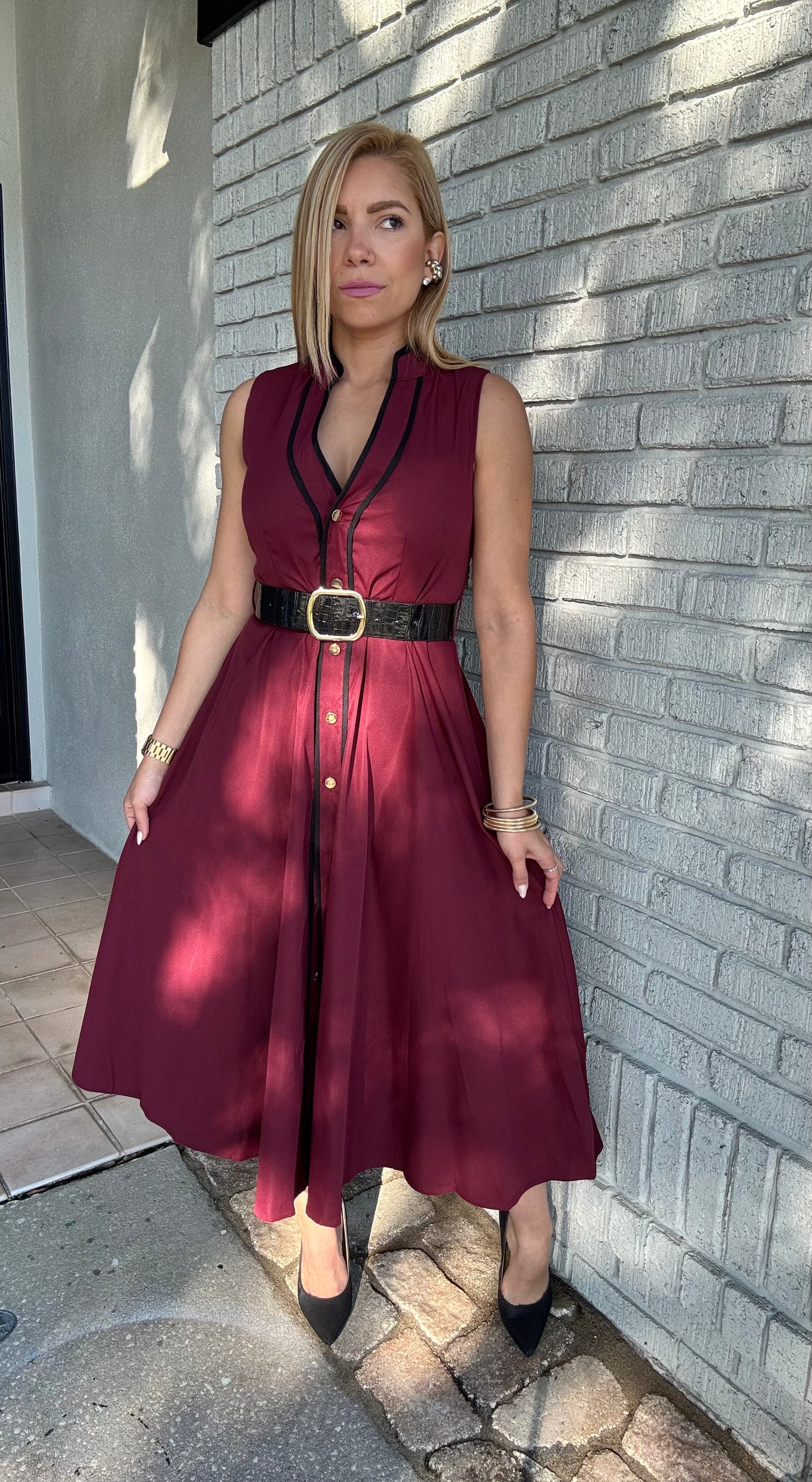Burgundy sleeveless V-neck belted dress with front buttons and front slit