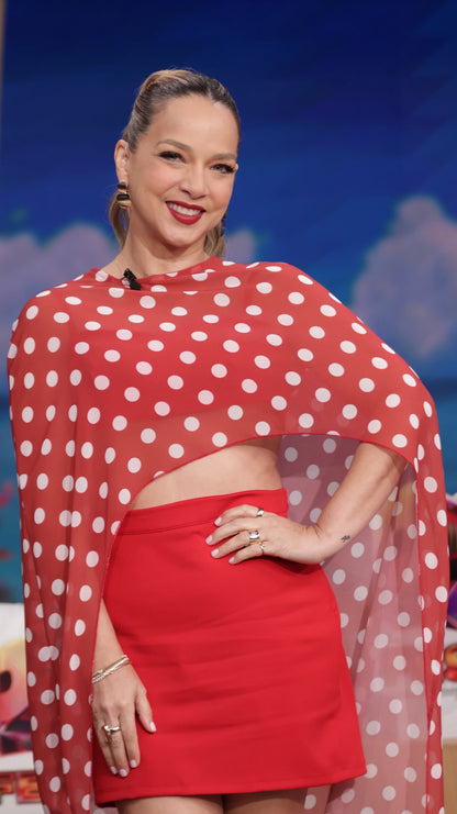 Red polka-dot cape top with high neck and fitted red mini skirt