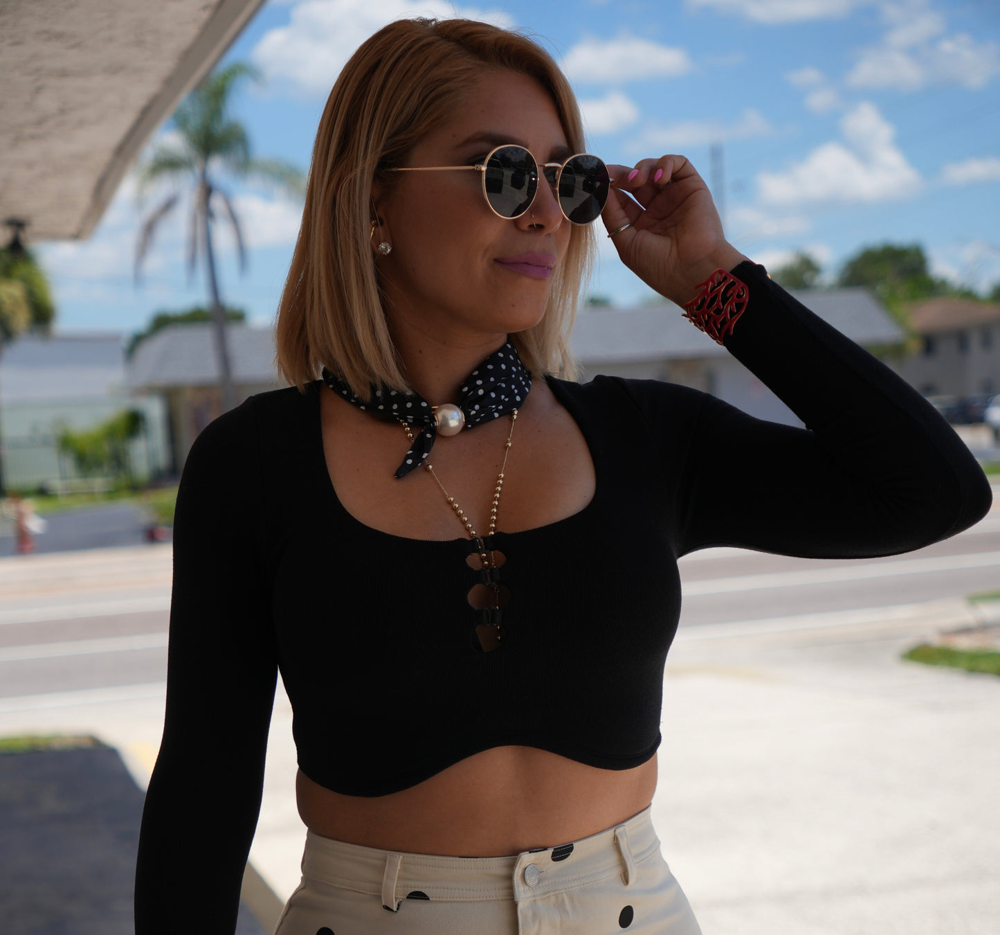 Black fitted long-sleeve crop top with scoop neckline