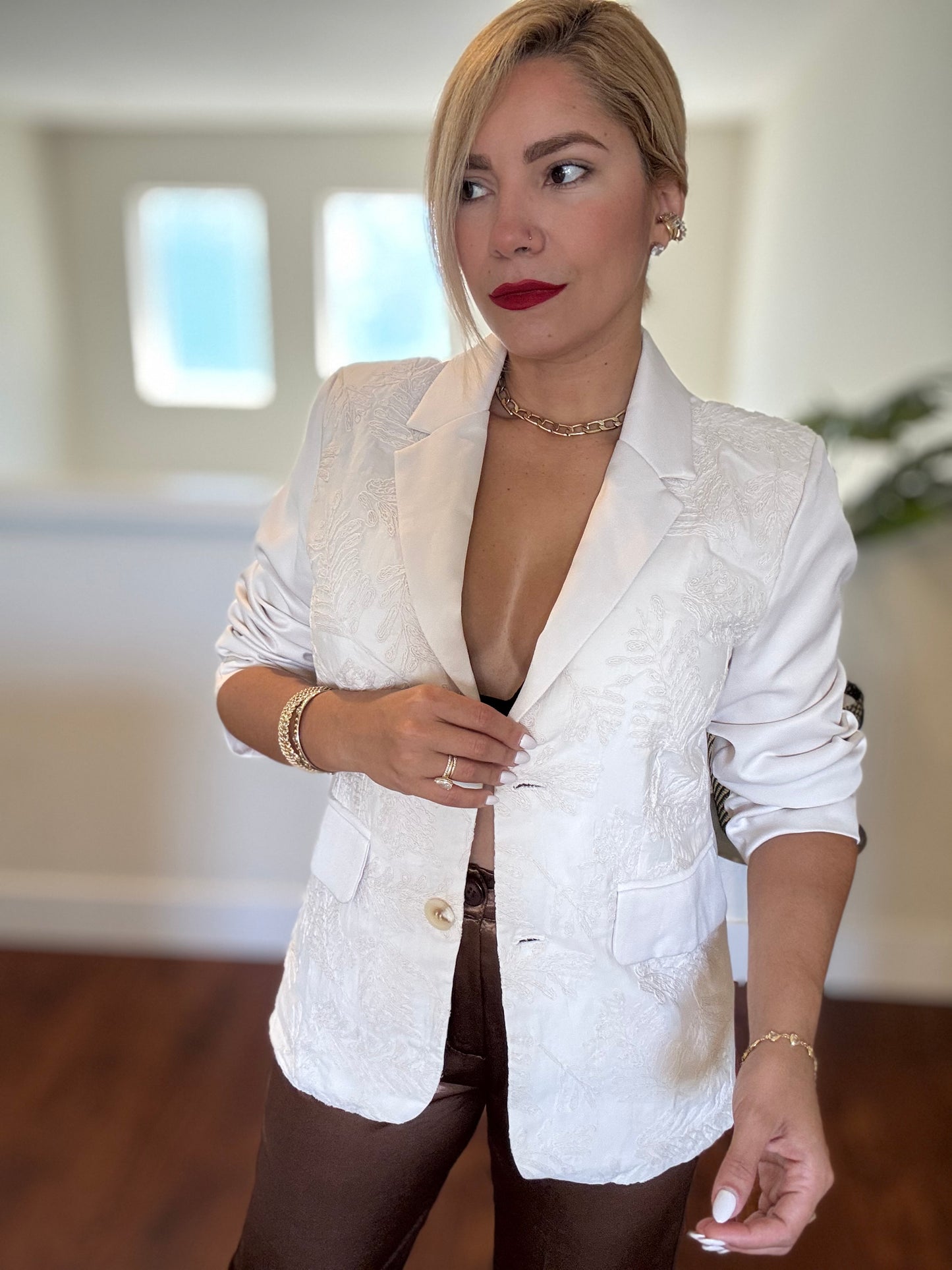 Ivory textured blazer with front pocket and gold buttons