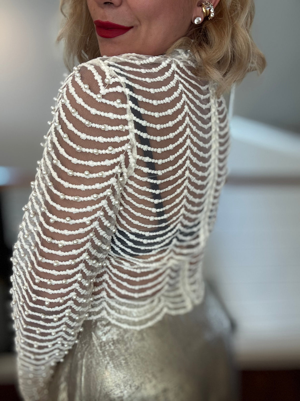 Isadora Perls top close-up in bone white, pearl-striped long sleeve with mock neck