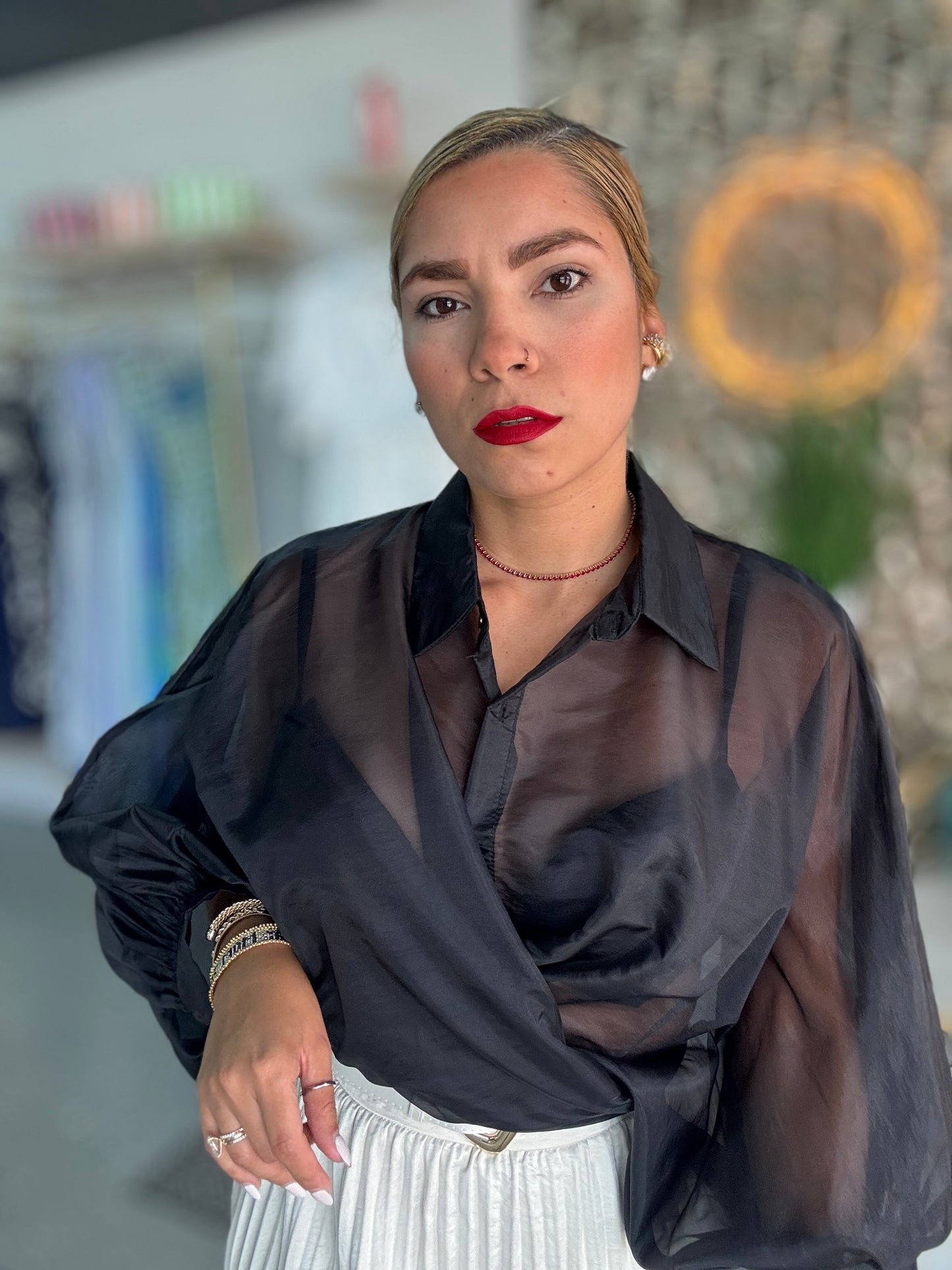 Black sheer blouse top with V-neckline and long sleeves